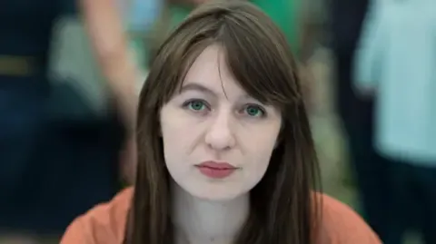 The acclaimed novelist claims she cannot visit the UK due to arrest fears